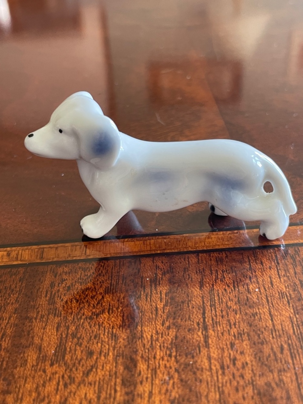 Vintage Porcelain Dachshund Figurine in White with Blue Accents